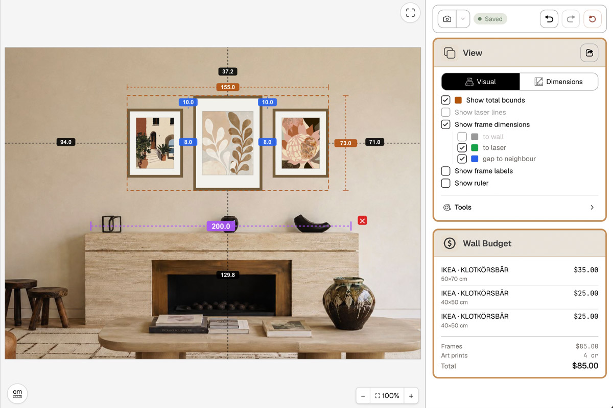 HangPlanner editor: three plant prints above a mantel with total bounds of 155 × 73 cm labelled along with every gap and the height off the floor, and the Wall Budget panel listing each IKEA KLOTKÖRSBÄR 50×70 / 40×50 frame's price, $85 total