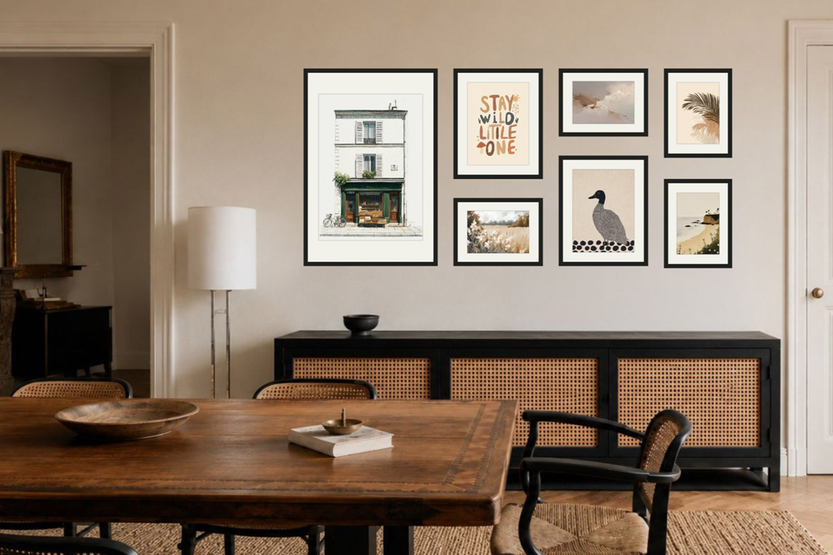 A dining gallery wall above a sideboard: the arrangement sits squarely above a cane sideboard, anchored to the furniture