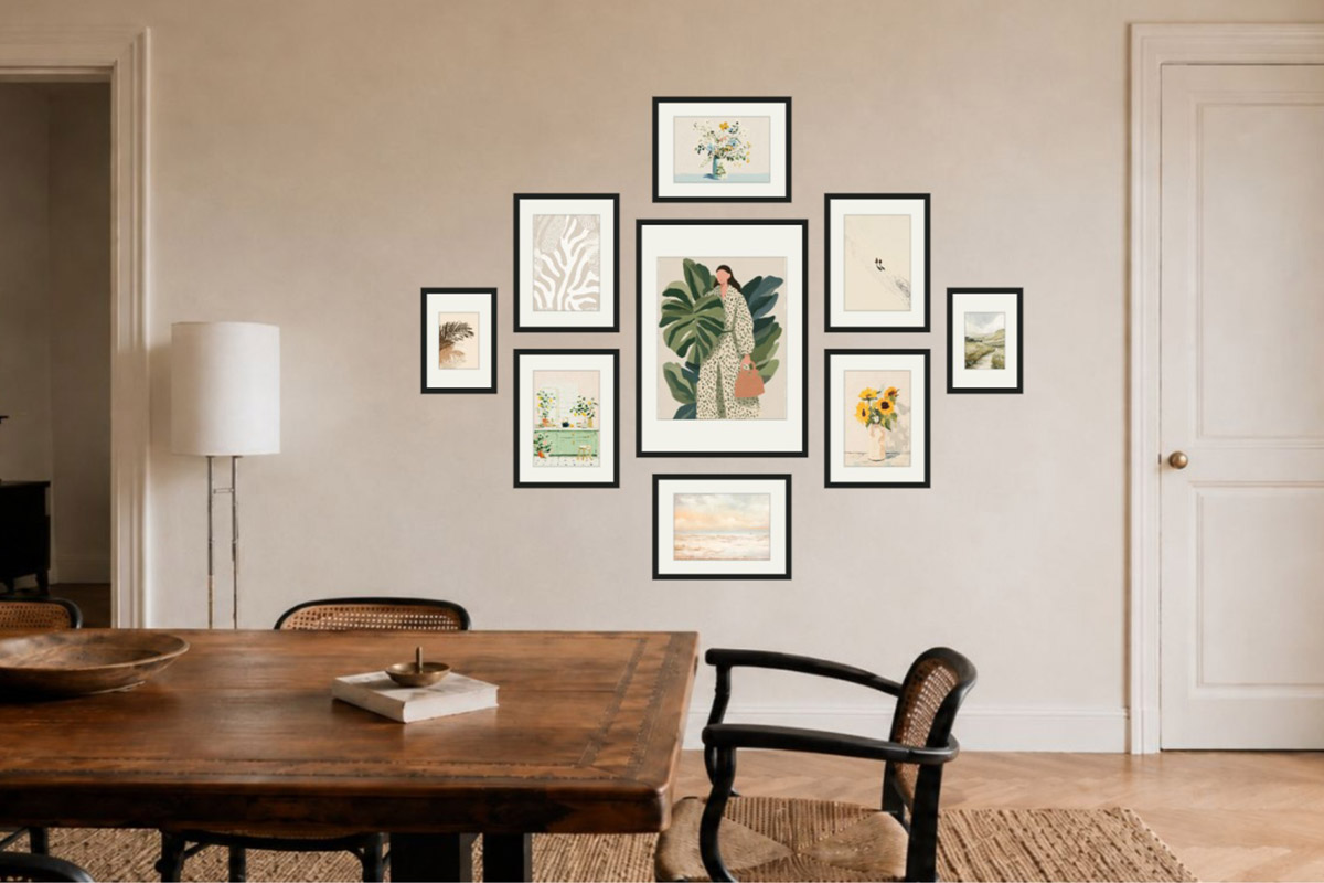A dining gallery wall on a full open wall: a nine-frame focal arrangement centered on the wall, with a door on each side