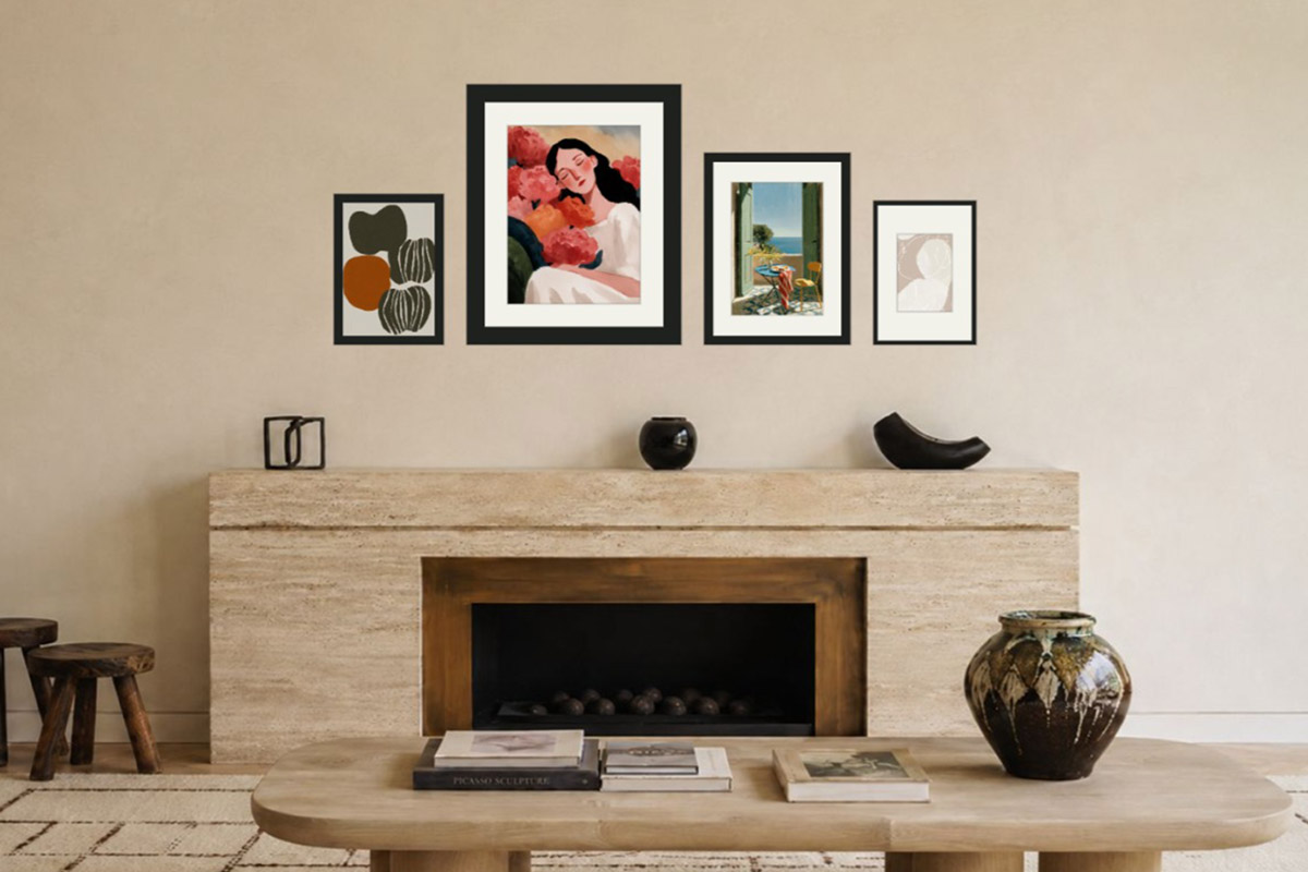 A five-piece gallery wall sits neatly above a wooden mantel: the group spans about two-thirds of the mantel with margins on each side, and the objects on the shelf form a separate layer below the art