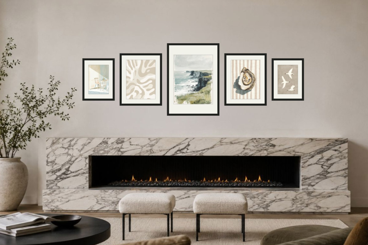 A gallery wall above a lit marble fireplace: above a working fireplace, leave height above the shelf and favour light-fast images so heat and soot don't damage precious prints